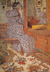 Édouard Vuillard, Madame Vuillard arranging her hair. 1900.Oil on cardboard, laid on wood. © The Henry Barber Trust, the Barber Institute of Fine Arts, University of Birmingham Woman in a patterned dress seated at a dressing table, seen from behind, adjusting her hair in front of a mirror.